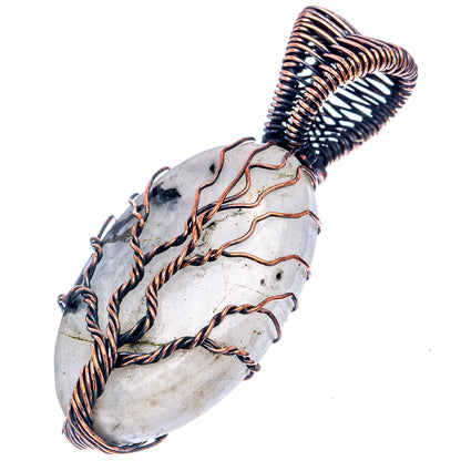 Oxidized copper wire-wrapped moonstone pendant with dark stone accents, tree motif