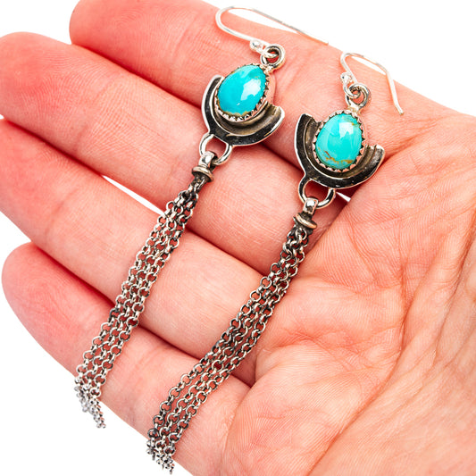 Turquoise oval drop earrings with scalloped silver setting and dangling chain links