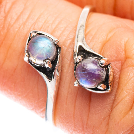Sterling silver moonstone ring with oval iridescent blue-purple stone, prong setting