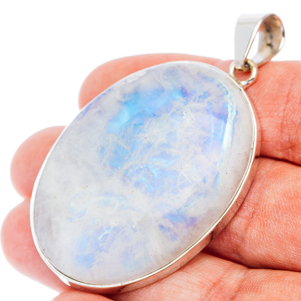 Sterling silver rainbow moonstone pendant with oval opal-like cabochon and round bail