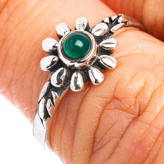 Dainty sterling silver flower ring with green cabochon gemstone and petal setting