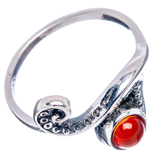 Sterling silver ring with wave design and red oval carnelian cabochon, side view