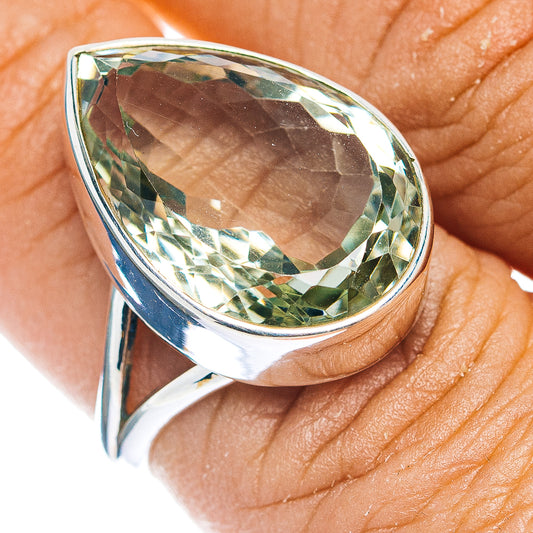Sterling silver ring with large pear-cut green amethyst, faceted halo bezel