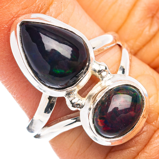 Sterling silver ring with two dark teardrop opal cabochons, green-red shimmer