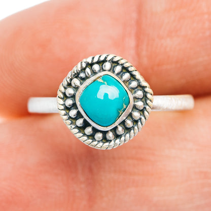Turquoise oval cabochon ring with raised sterling silver bead border