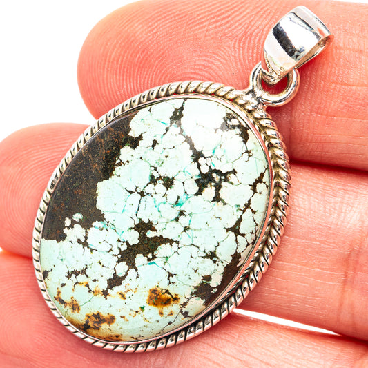 Pear-shaped turquoise cabochon pendant in .925 sterling silver bezel with bail