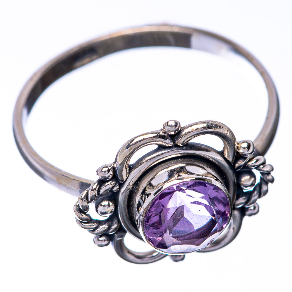 Sterling silver amethyst ring with oval purple center stone and curled bead filigree band