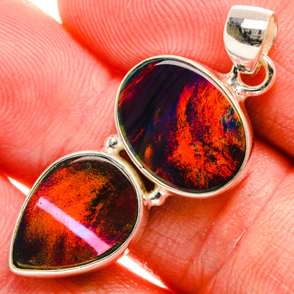 Sterling silver pendant with two teardrop iridescent opal stones on a bail setting