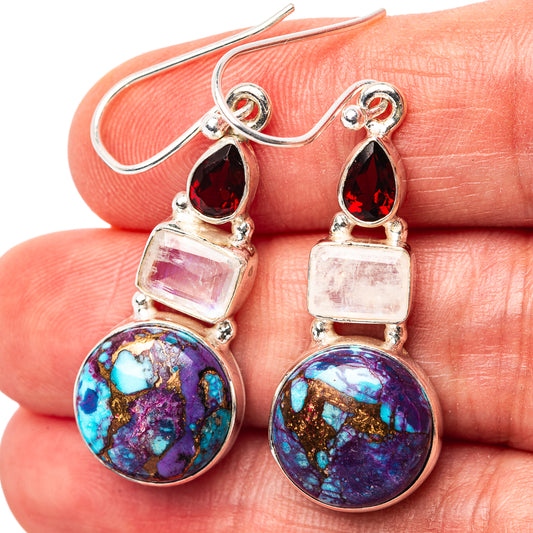 Sterling silver drop earrings, close-up: red teardrop tops and multicolor purple-blue oval stones