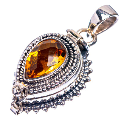 Oval amber gemstone pendant in sterling silver with detailed border and connector bail
