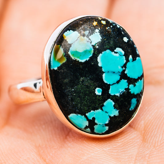 Sterling silver oval turquoise ring with bright blue stone and black webbing