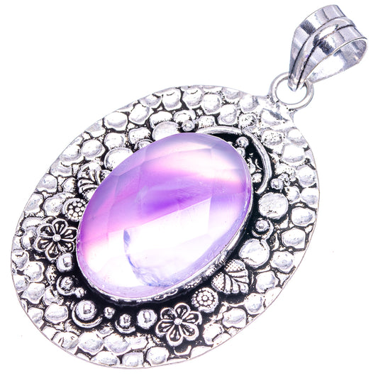 Purple oval agate pendant with textured silver-tone floral frame and hanging bail