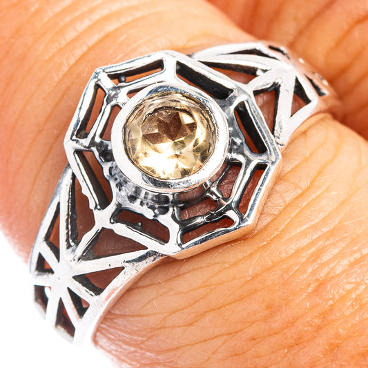 Sterling silver citrine dainty ring with open webwork and round gemstone, close-up