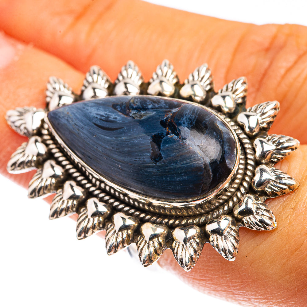 Sterling silver ring with oval blue pietersite cabochon and ornate leaf-style bezel