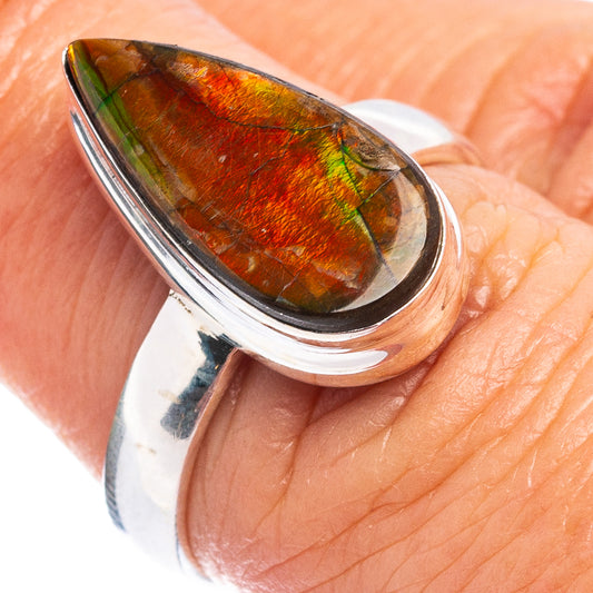 Sterling silver ring with teardrop ammolite in orange, red, and green hues