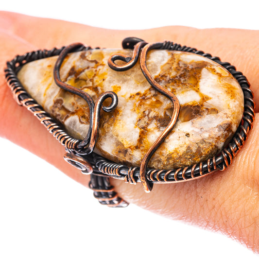 Oxidized copper wire wrap ring with honey agate oval stone, ornate swirl setting