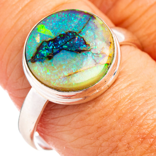 Sterling silver ring with round green-blue opal gemstone center bezel