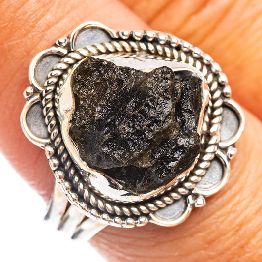 Sterling silver moldavite ring with dark rough stone and twisted bead bezel
