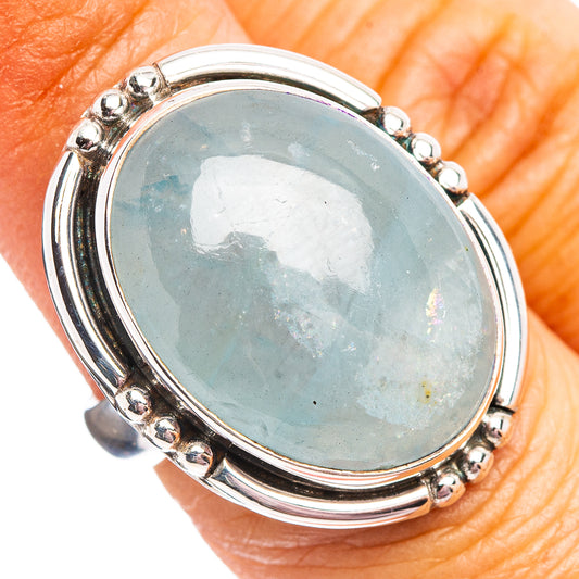 Oval aquamarine gemstone sterling silver ring with bead-set bezel