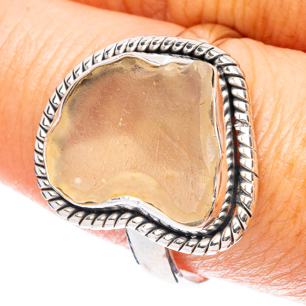 925 sterling silver ring with bezel-set natural desert glass, tan stone on finger