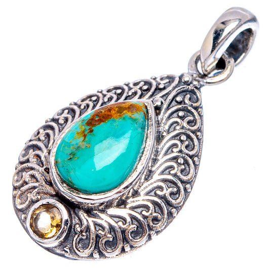 Ornate sterling silver teardrop pendant with turquoise cabochon and citrine accents.