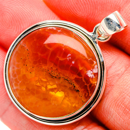 Fire crab agate pendant in round 925 silver bezel, orange-red stone view with bail