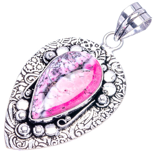 Pink dendritic opal teardrop pendant in ornate German silver setting with hanging loop