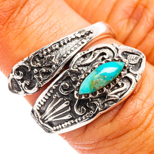 Adjustable sterling silver ring with ornate engraving and oval turquoise stone