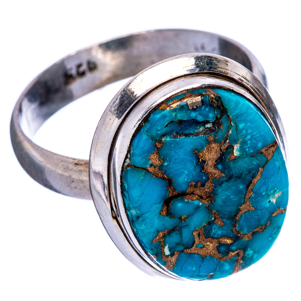 Sterling silver ring with round turquoise cabochon, copper pattern, and visible band
