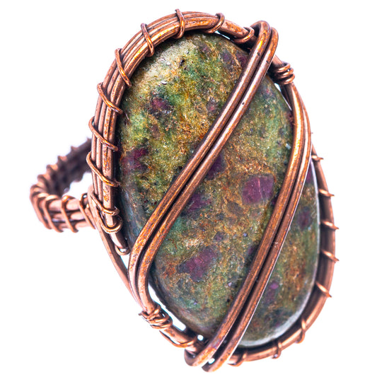 Oxidized copper wire-wrapped oval fuchsite stone ring with vertical copper bands, side view
