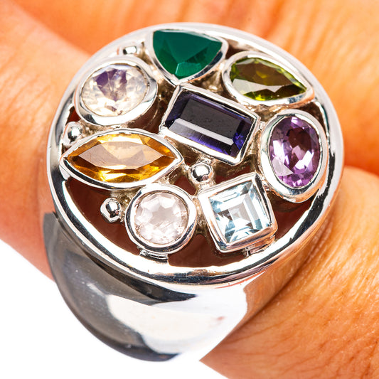Sterling silver ring with multicolor faceted gemstones, oval center and round side stones