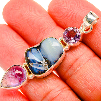 Sterling silver pendant with blue opal-style stone and purple and pink gemstone accents