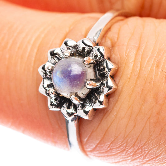 Sterling silver moonstone ring with oval light-lavender gem and textured halo setting