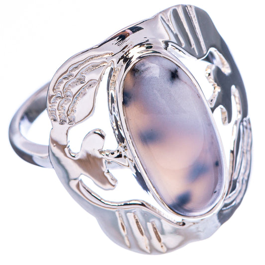 Polished sterling silver ring featuring oval gray-blue stone and ornate openwork