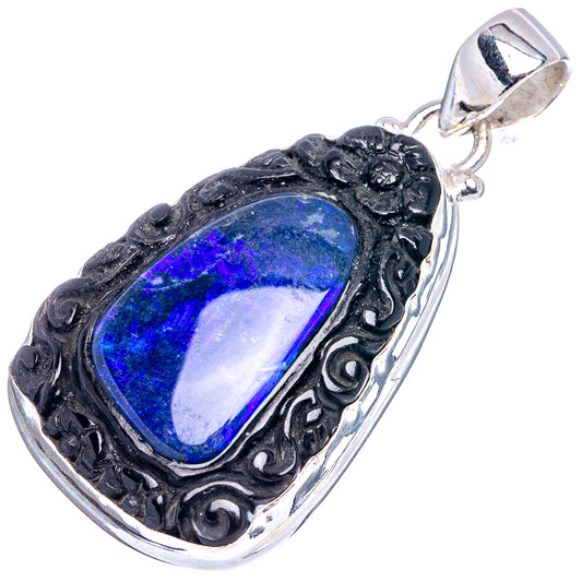 925 sterling silver opal pendant with blue oval cabochon and detailed filigree setting