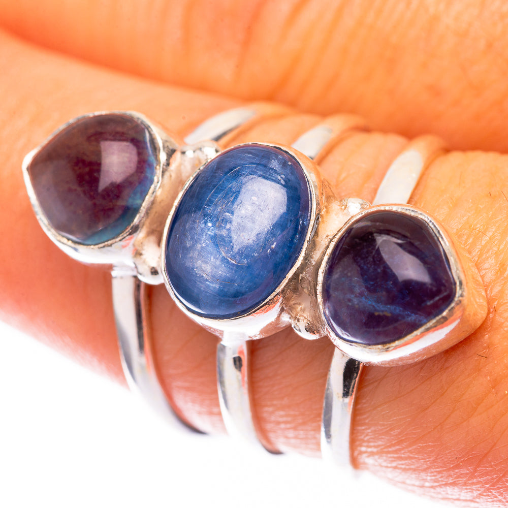 Sterling silver three-stone ring with deep blue oval cabochons and open band