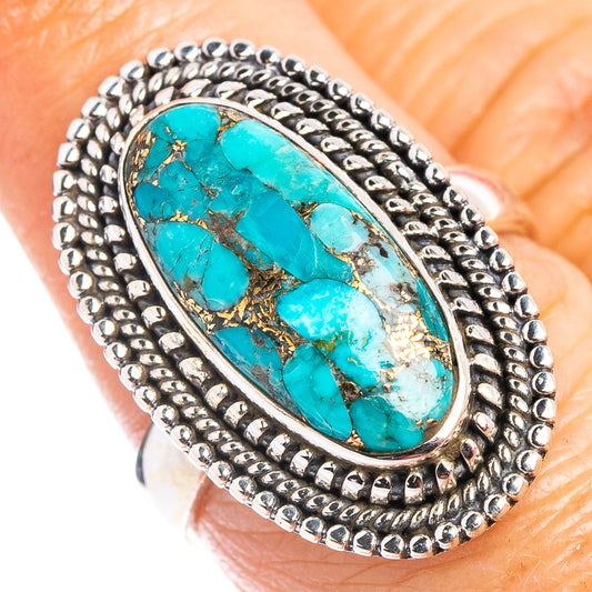 Turquoise oval ring in sterling silver with rope-texture bezel and dark matrix pattern