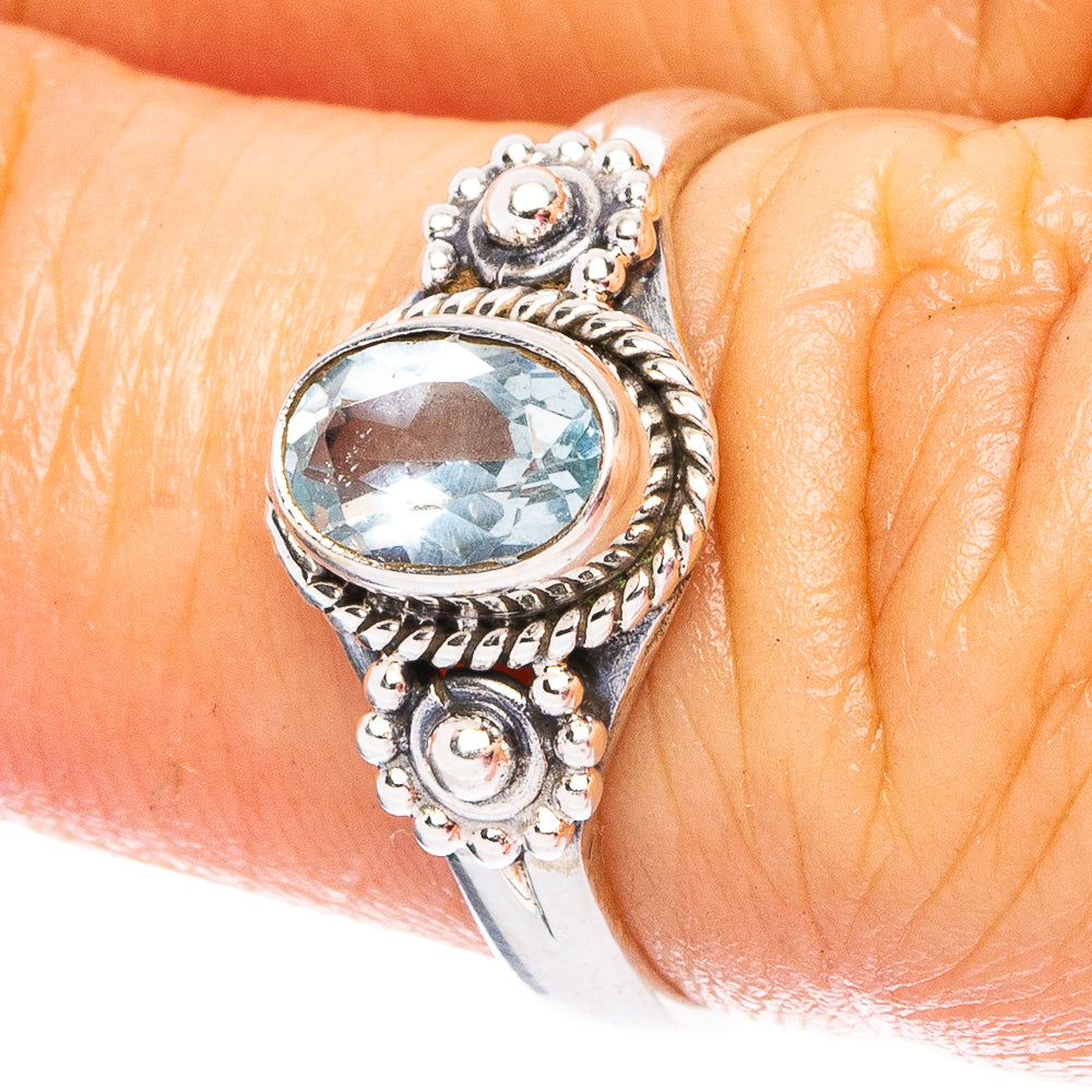 925 sterling silver ring with oval blue topaz gemstone and ornate bezel