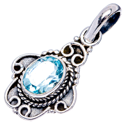 Sterling silver blue topaz pendant with loop bail, ornate filigree and round gemstone
