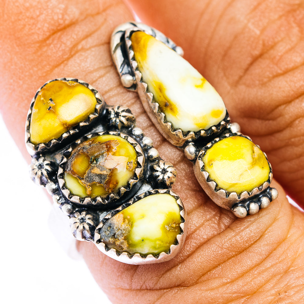 Silver adjustable ring with oval yellow stone clusters and decorative bezel details