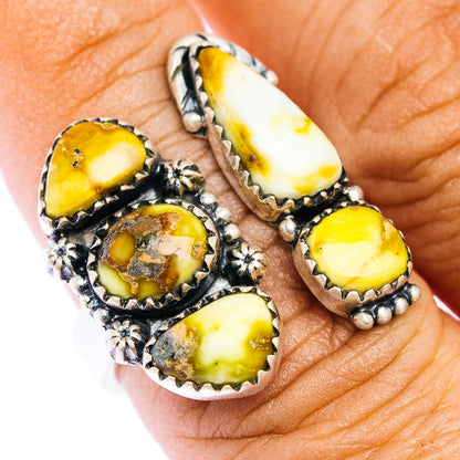 Silver adjustable ring with oval yellow stone clusters and decorative bezel details