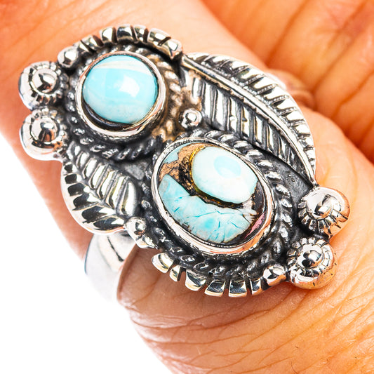 Silver turquoise oval cabochon ring with carved borders and textured side accents