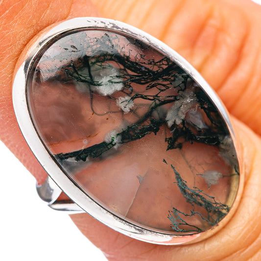 Sterling silver ring with oval green moss agate cabochon, dark dendritic veining.