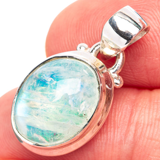Sterling silver moonstone pendant with oval blue-green cabochon in raised bezel and loop bail