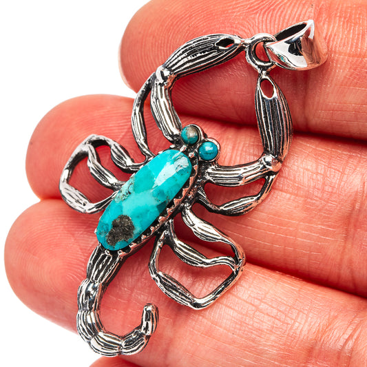Turquoise scorpion pendant in .925 sterling silver with blue-green gemstone details
