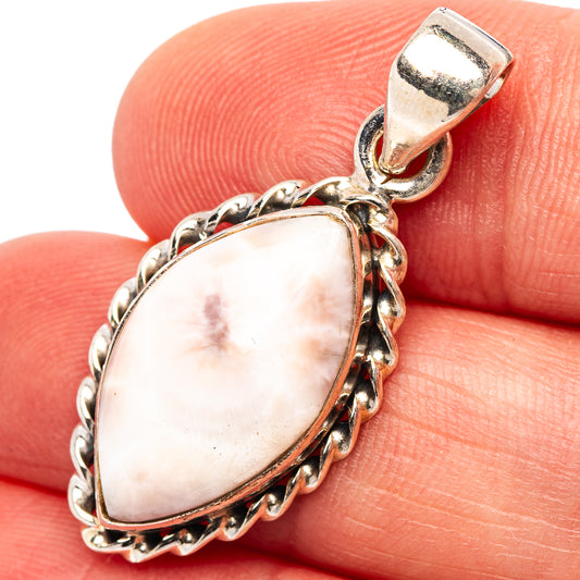 Pink natrolite teardrop pendant in .925 sterling silver with link chain bezel