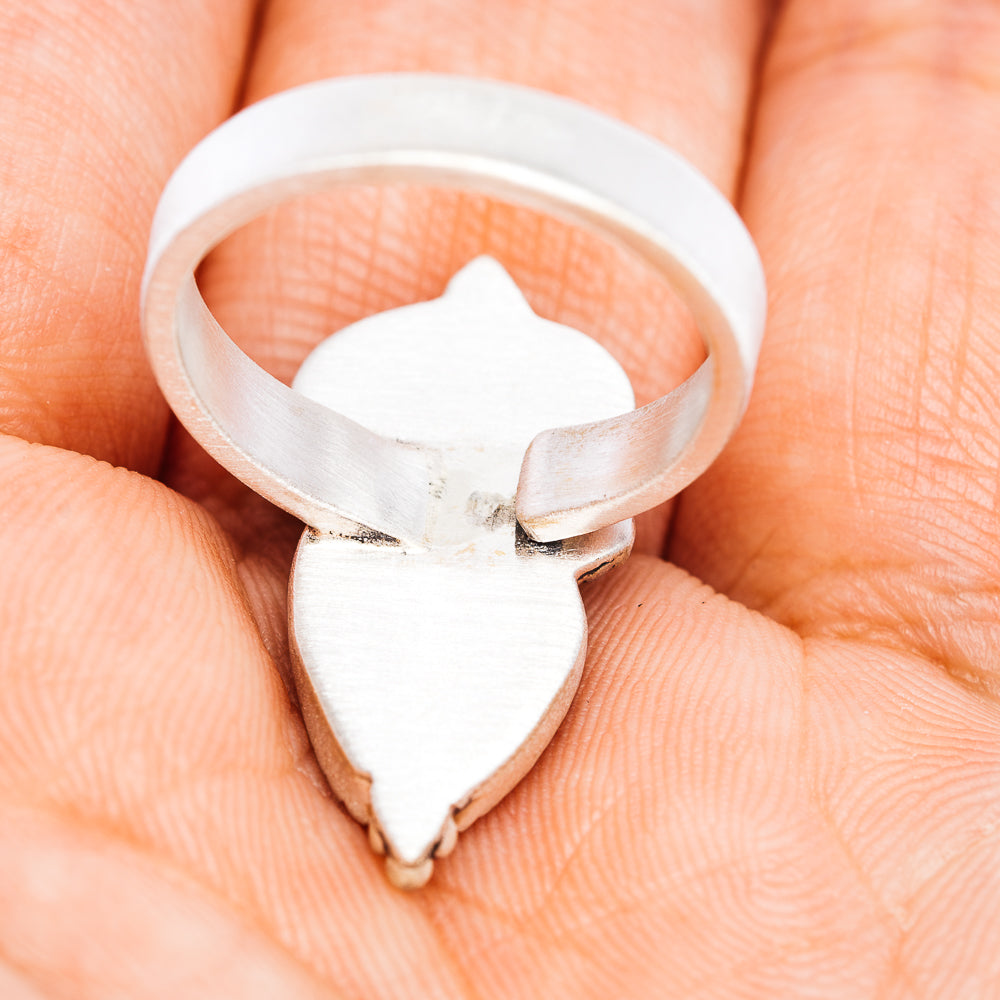 Sterling silver adjustable ring with heart-shaped shield setting on a wide band