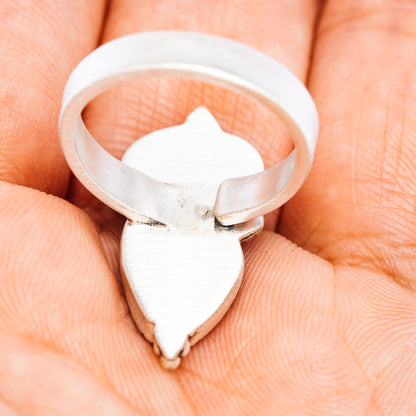 Sterling silver adjustable ring with heart-shaped shield setting on a wide band