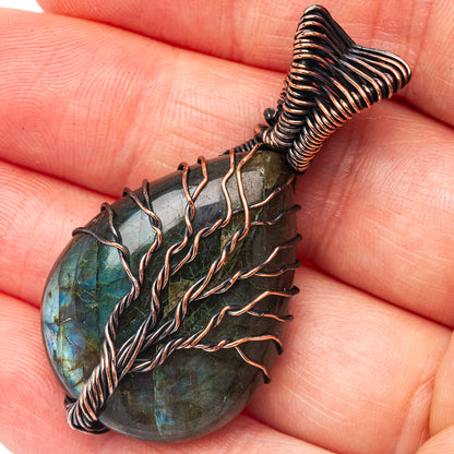Labradorite teardrop pendant with oxidized copper wire tree-of-life design