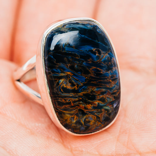 Pietersite oval ring with dark blue and amber swirls on a .925 sterling silver band